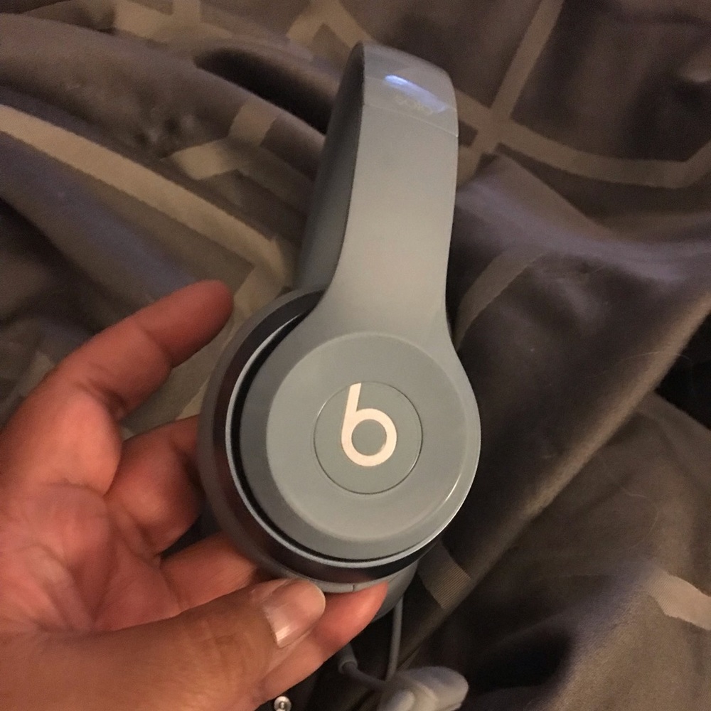 Pale blue beats headphone.